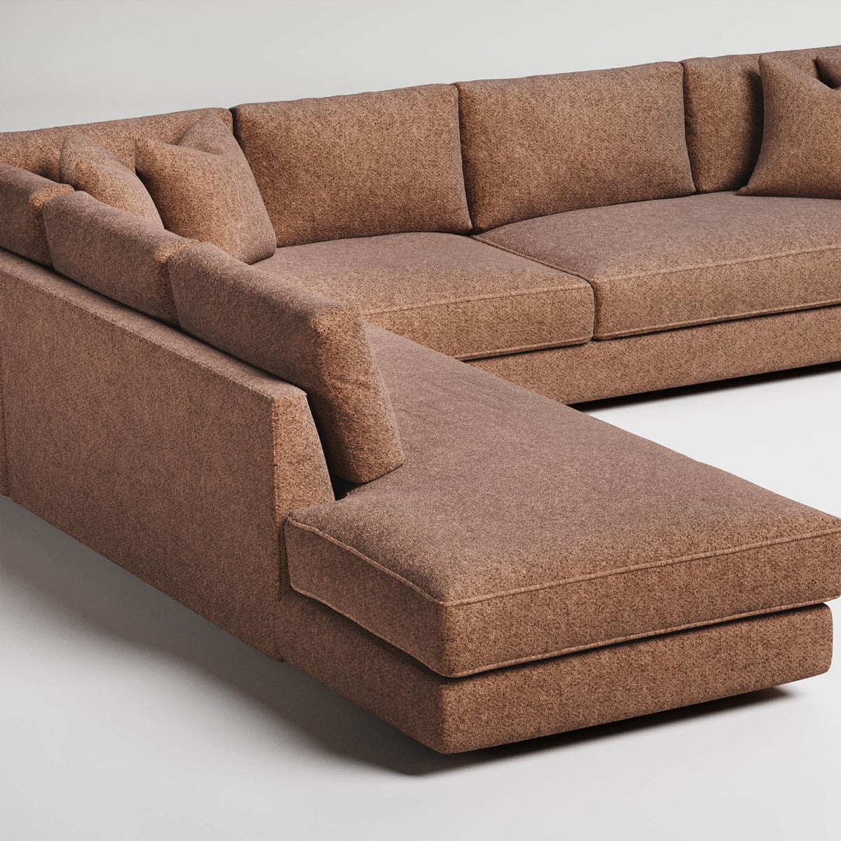 L-shaped brown sectional sofa with textured upholstery and clean modern lines on white background