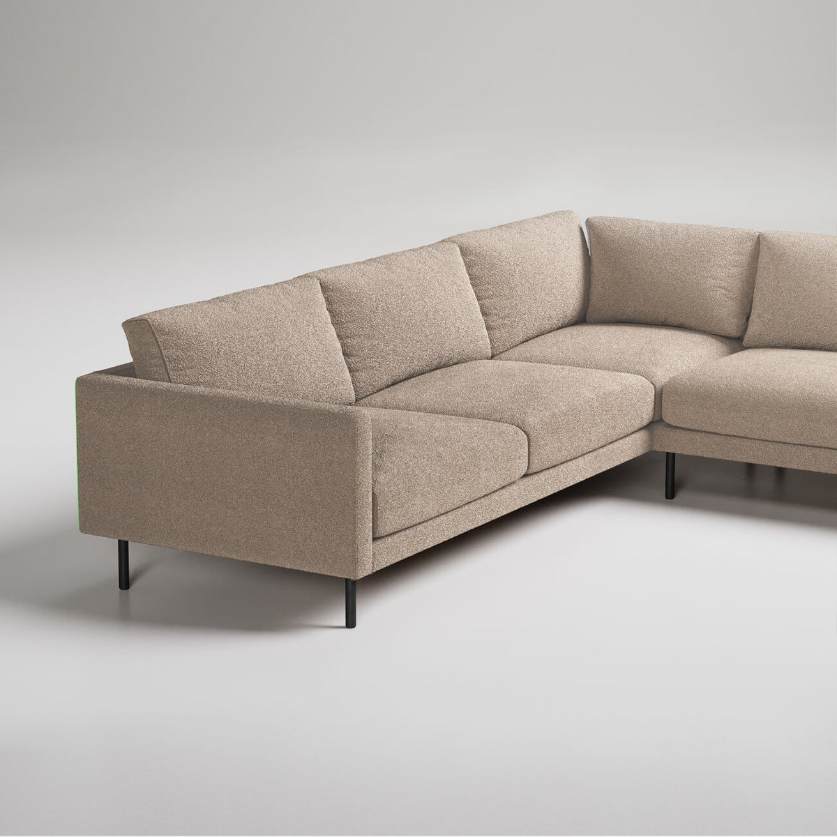 Modern L-shaped sectional sofa in beige fabric with black metal legs, photographed against white background