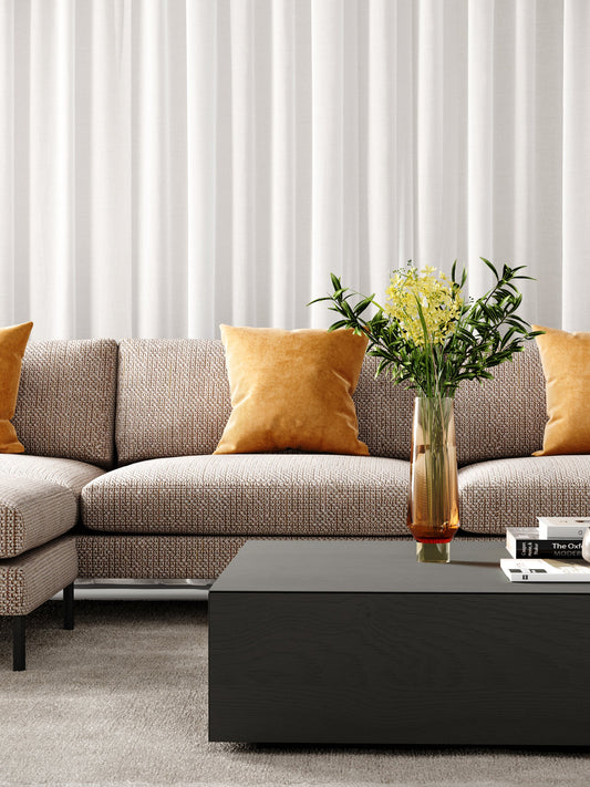 Cozy corner lounge suite upholstered in soft fabric