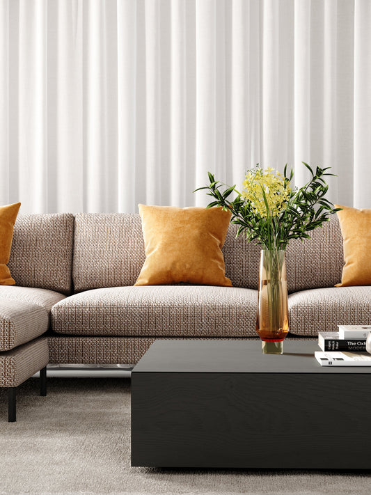 Modern grey couch in Melbourne living room with timber floors
