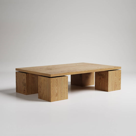 Modern low rectangular coffee table with natural oak finish and three cube-shaped supports on light background