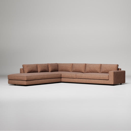 Modern L-shaped sectional sofa in brown fabric with clean lines and chaise lounge, against light gray background