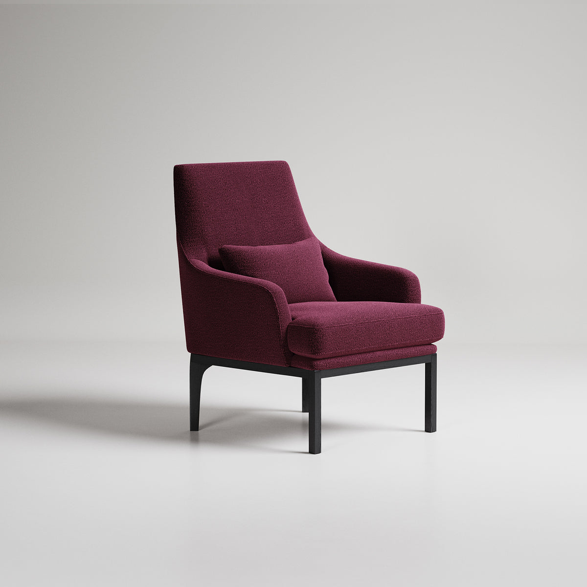 Modern burgundy velvet armchair with black metal legs on white background, studio product photography
