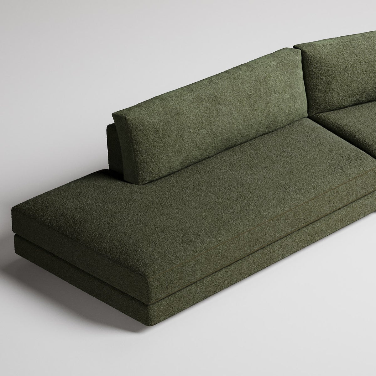 Modern olive green chaise lounge sofa section with minimalist design against white background
