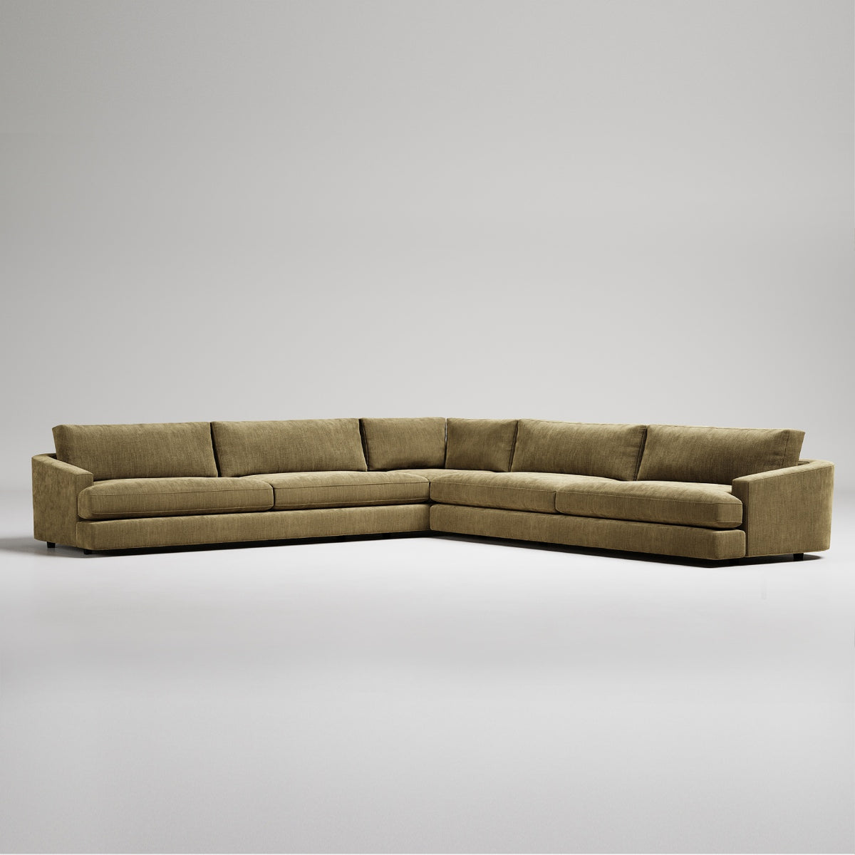 Modern L-shaped sectional sofa in olive green textured fabric against white background
