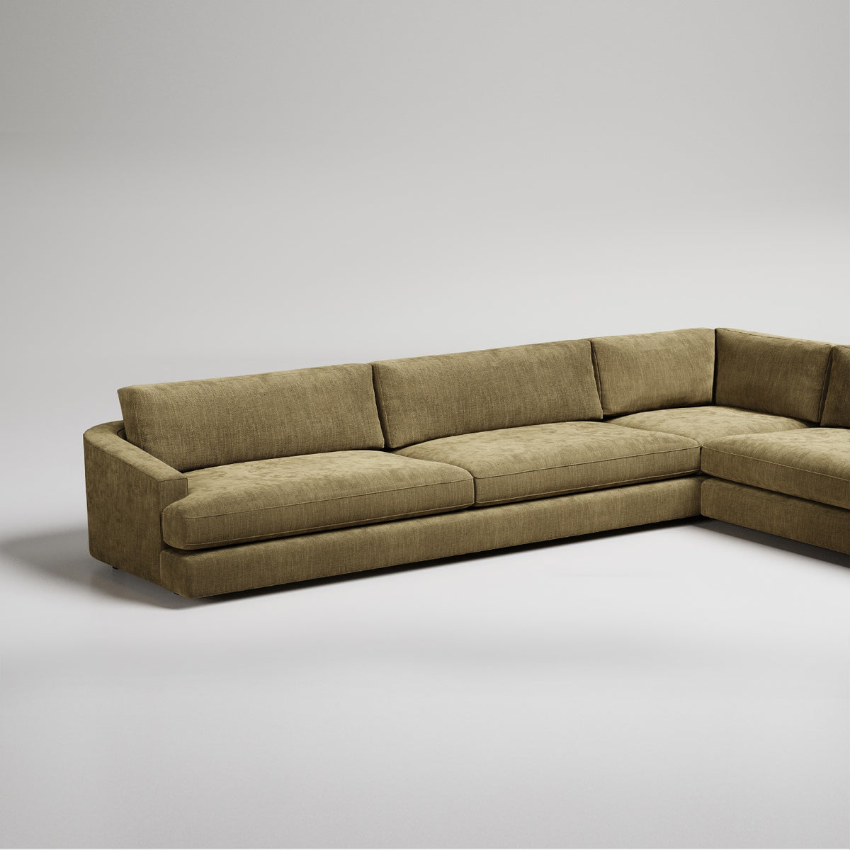 Modern L-shaped sectional sofa in olive green textured fabric against white background, clean minimal design.
