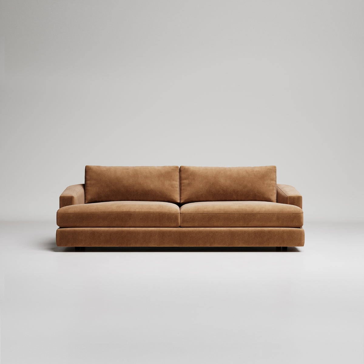 Modern tan velvet sofa with clean lines on white background, minimalist contemporary furniture design
