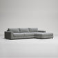 Modern grey L-shaped sectional sofa with chaise lounge on white background, minimalist furniture design
