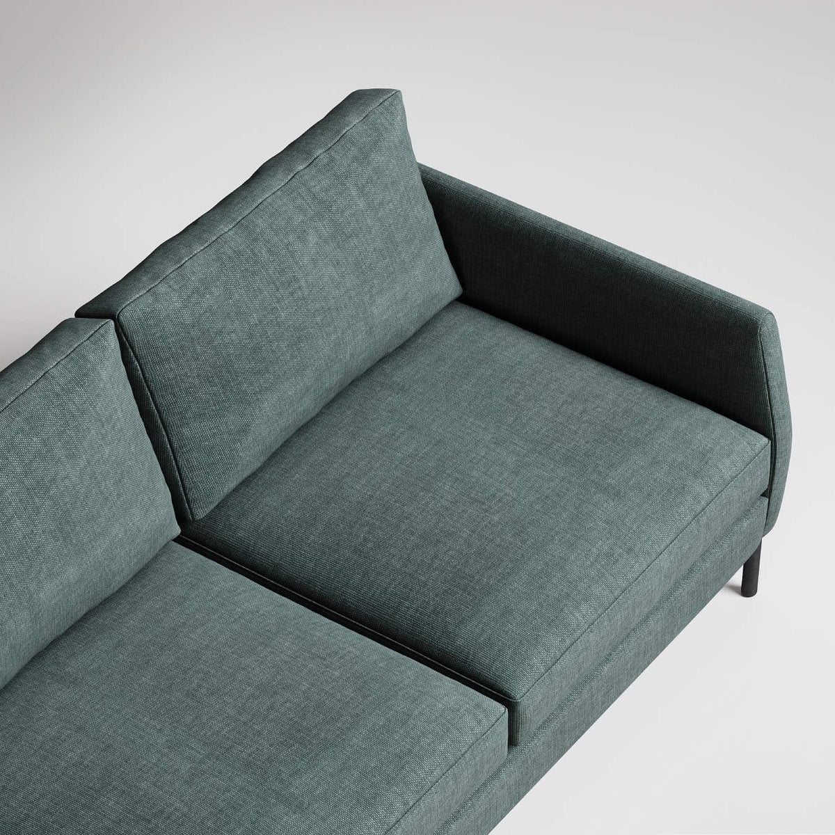 Modern sage green sectional sofa with clean lines and textured upholstery, viewed from above against white background
