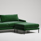 Modern green velvet sectional sofa with chaise ottoman on black metal legs against white background
