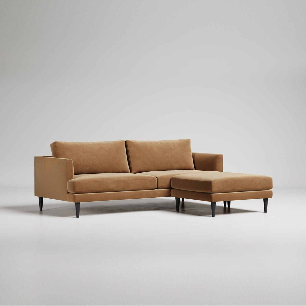 Modern brown sectional sofa with chaise lounge, tapered black legs, clean lines against white background
