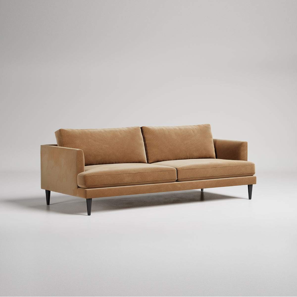 Modern tan velvet sofa with black legs on white background, contemporary minimal design studio photo
