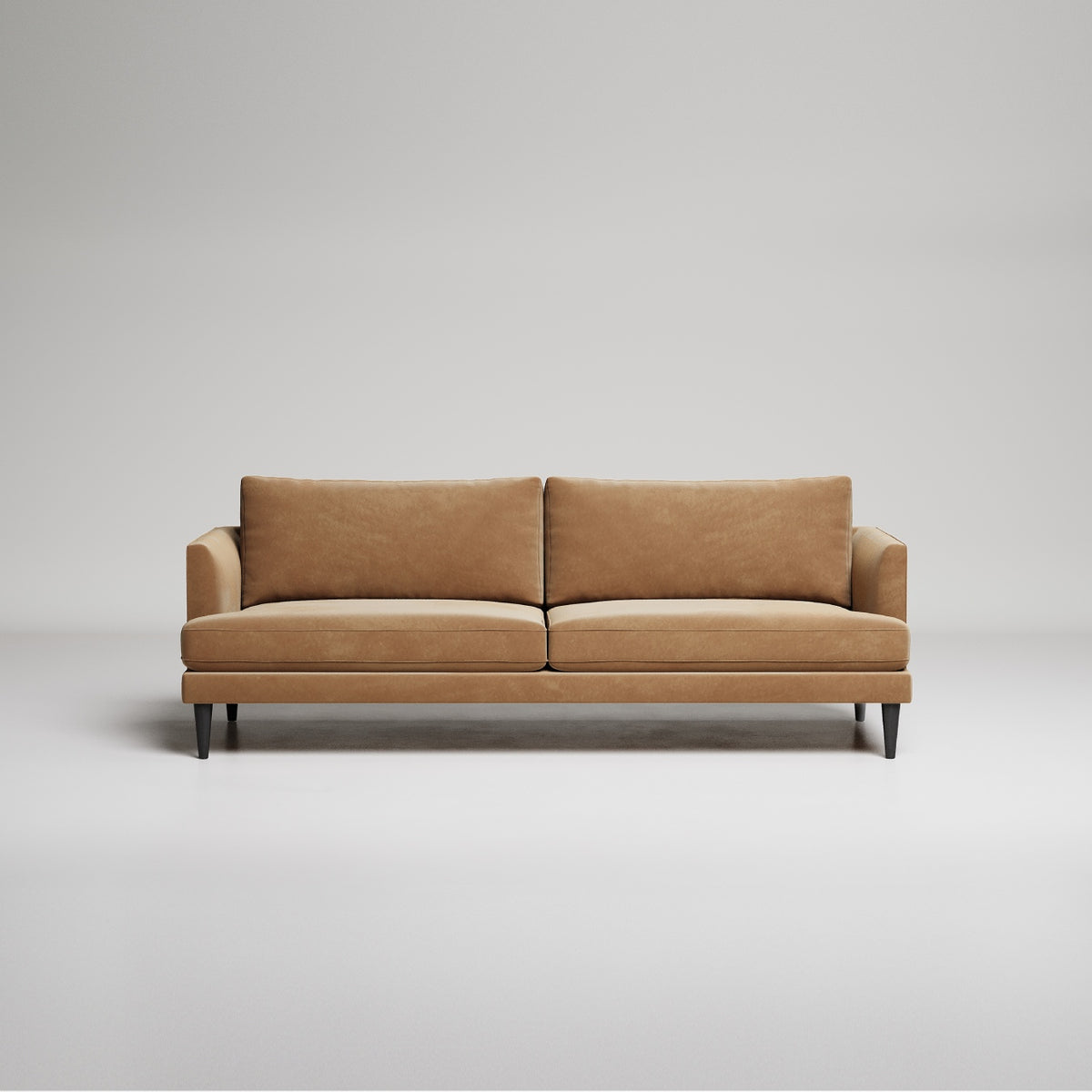 Modern tan leather sofa with slim black legs against neutral gray background, minimalist studio shot
