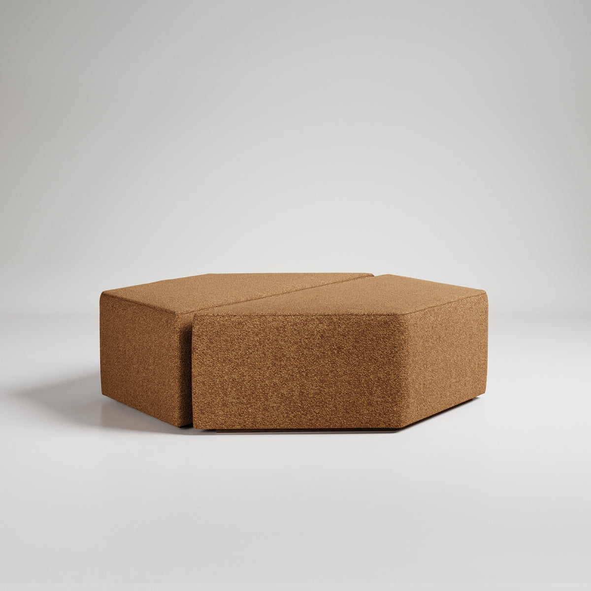 Modern hexagonal tan upholstered ottoman on white background, minimalist furniture piece, textured fabric
