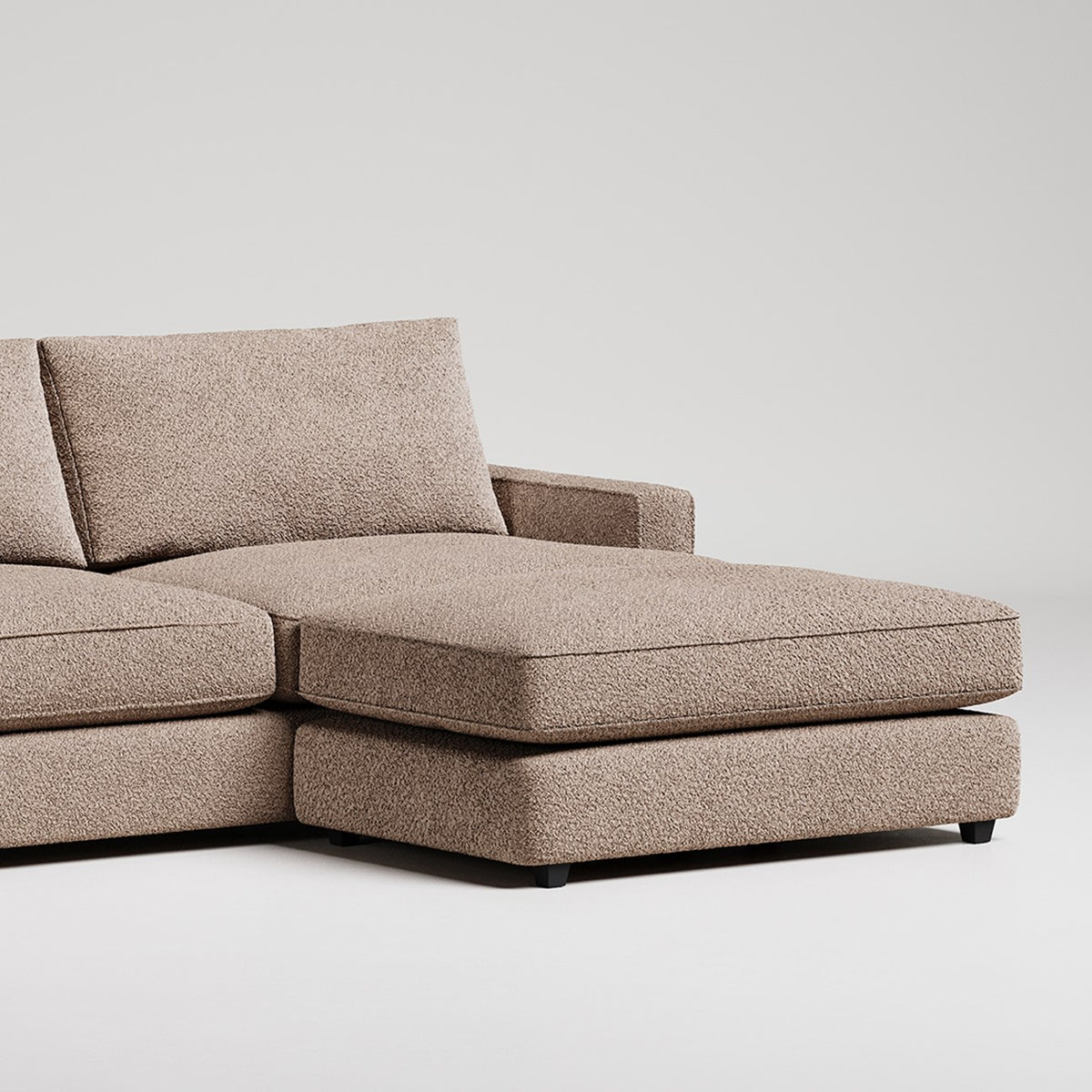 Modern L-shaped sectional sofa in taupe textured fabric with chaise lounge on white background
