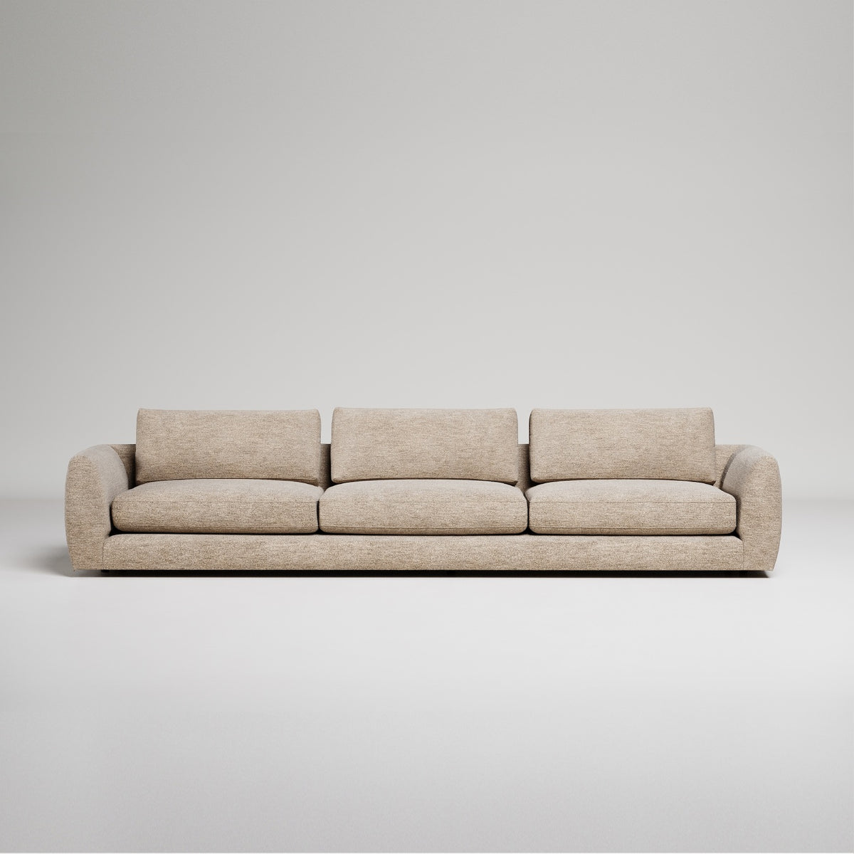 Modern beige sofa with curved arms on white background, minimalist contemporary furniture design