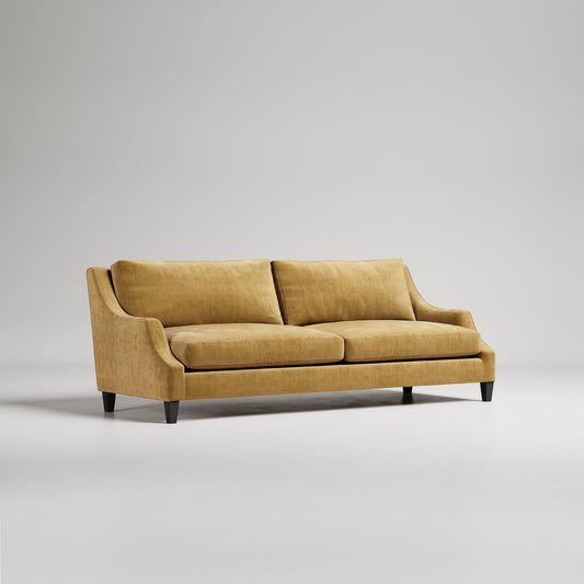 Modern gold velvet sofa with curved arms, black legs and plush cushions against light gray background
