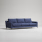 Modern navy blue 3-seater sofa with metal legs, textured fabric upholstery, against light gray background
