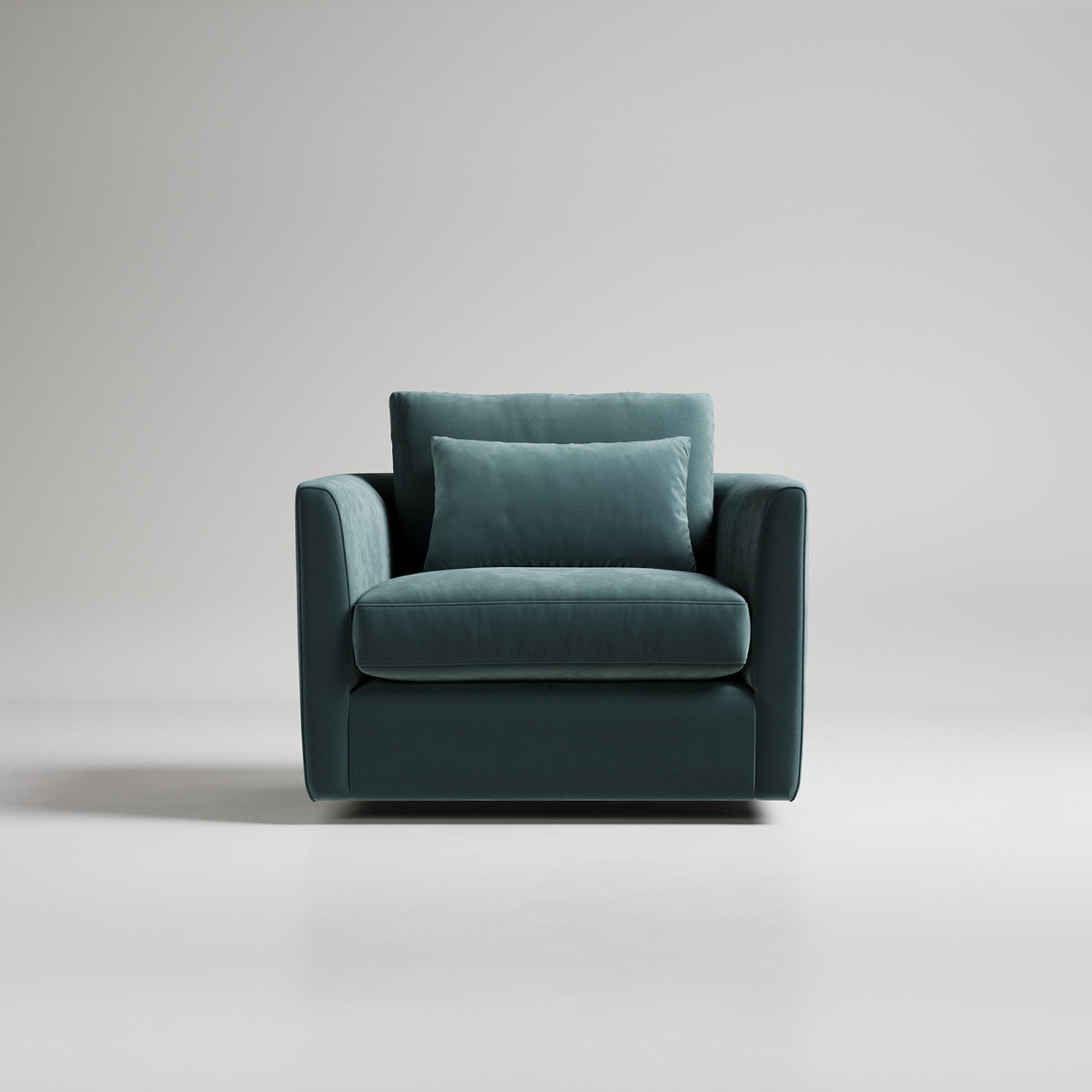 Teal velvet modern armchair with clean lines and matching throw pillow against light gray backdrop
