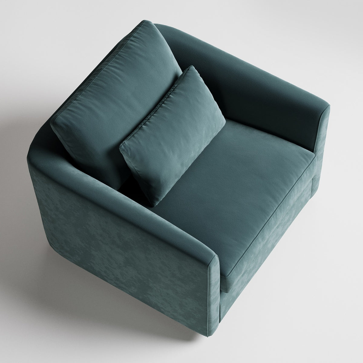 Modern teal velvet armchair with clean lines photographed from above on white background
