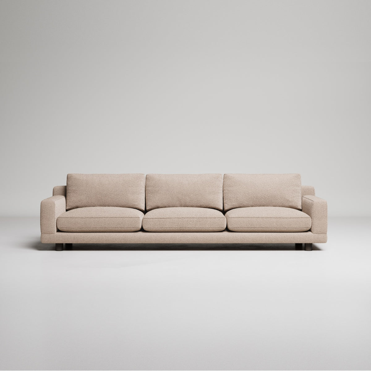 Modern beige 3-seater sofa with clean lines and plush cushions against neutral gray backdrop
