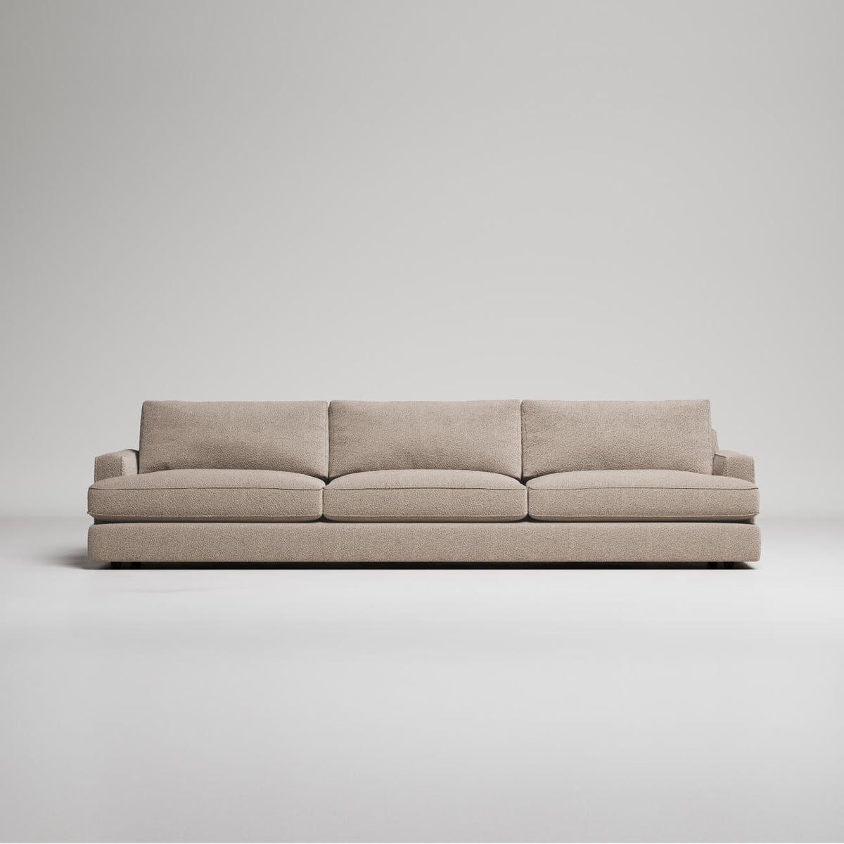 Modern 3-seater sofa in beige textured fabric, clean lines, against light gray background, minimalist style
