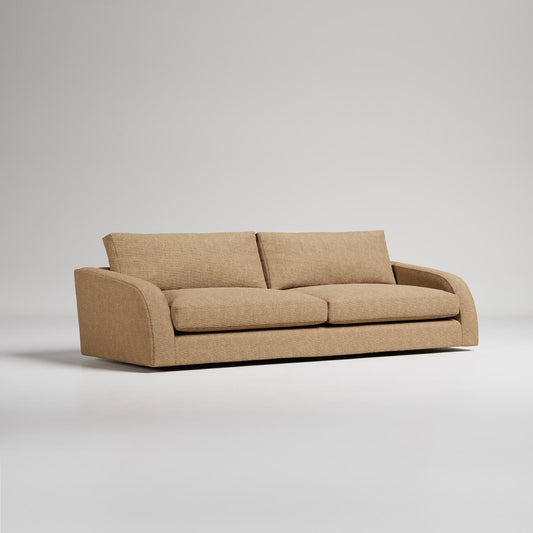 Modern beige upholstered sofa with curved arms on light gray background, contemporary furniture product shot
