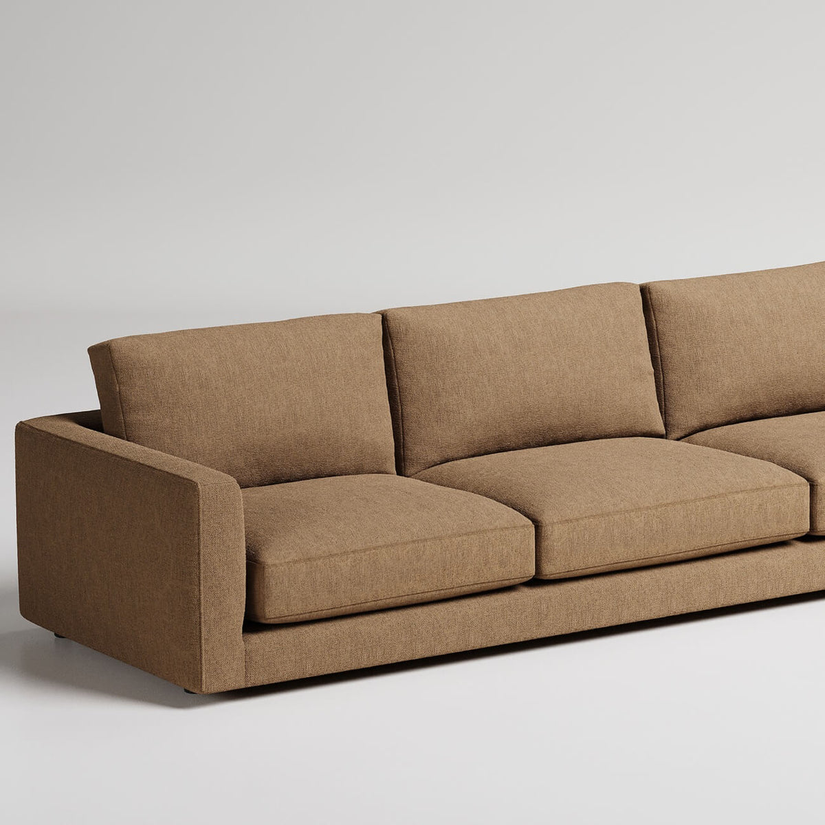 Modern brown fabric sectional sofa with clean lines and wide track arms against white background
