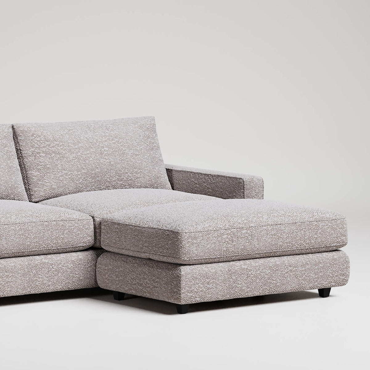 Modern grey L-shaped sectional sofa with chaise lounge on white background, textured upholstery fabric
