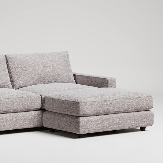 Modern grey L-shaped sectional sofa with chaise lounge on white background, textured upholstery fabric

